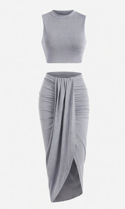 👗 Ujjatlan, magas nyakú, redős, karcsúsító kétrészes szett – a redőzött kivitelnek köszönhetően formás és elegáns, mind a munkába járáshoz, mind randevúhoz ideális